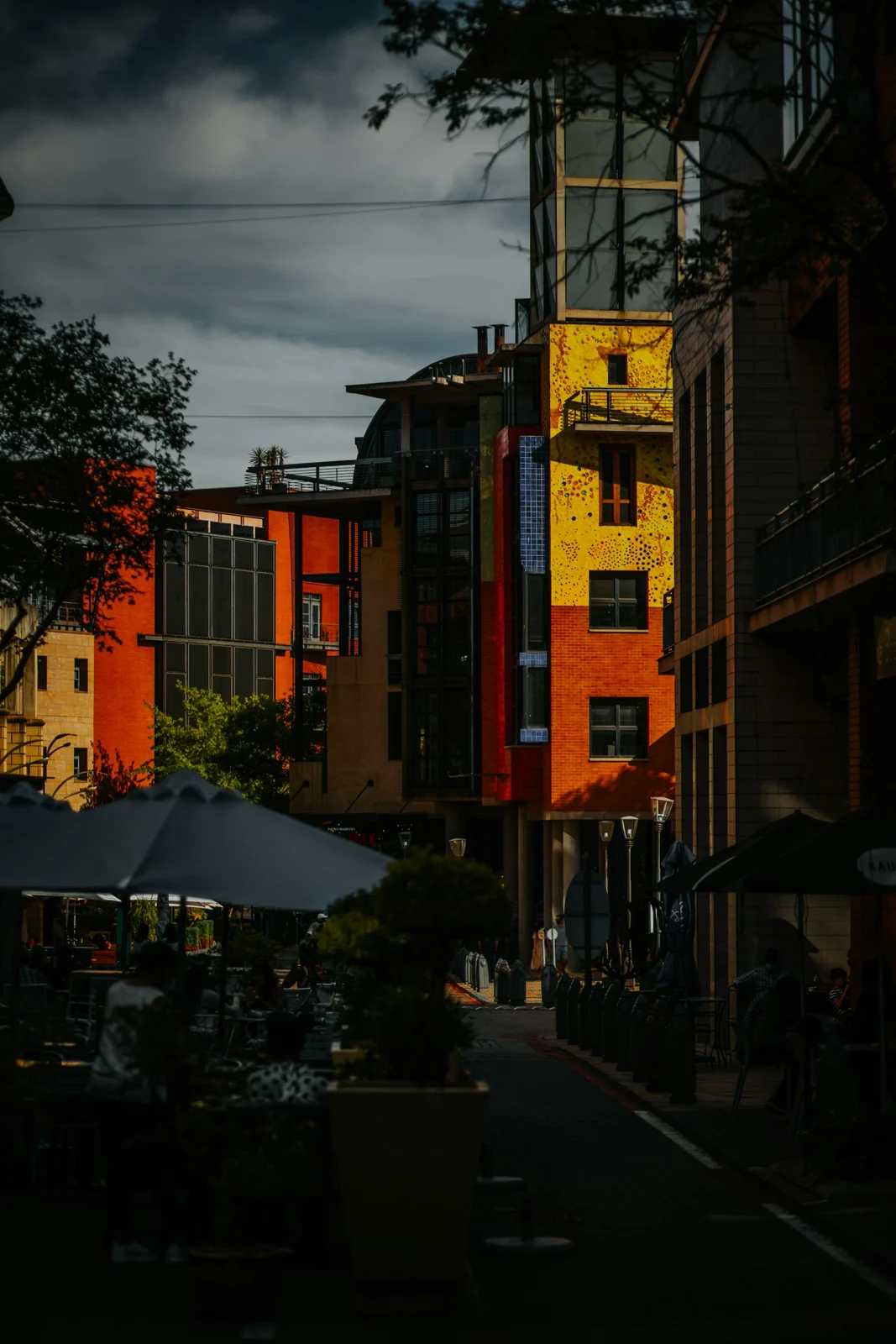 Yellow and terracotta architecture at Melrose Arch, Johannesburg